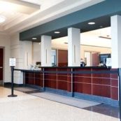 an empty lobby with a check in counter.